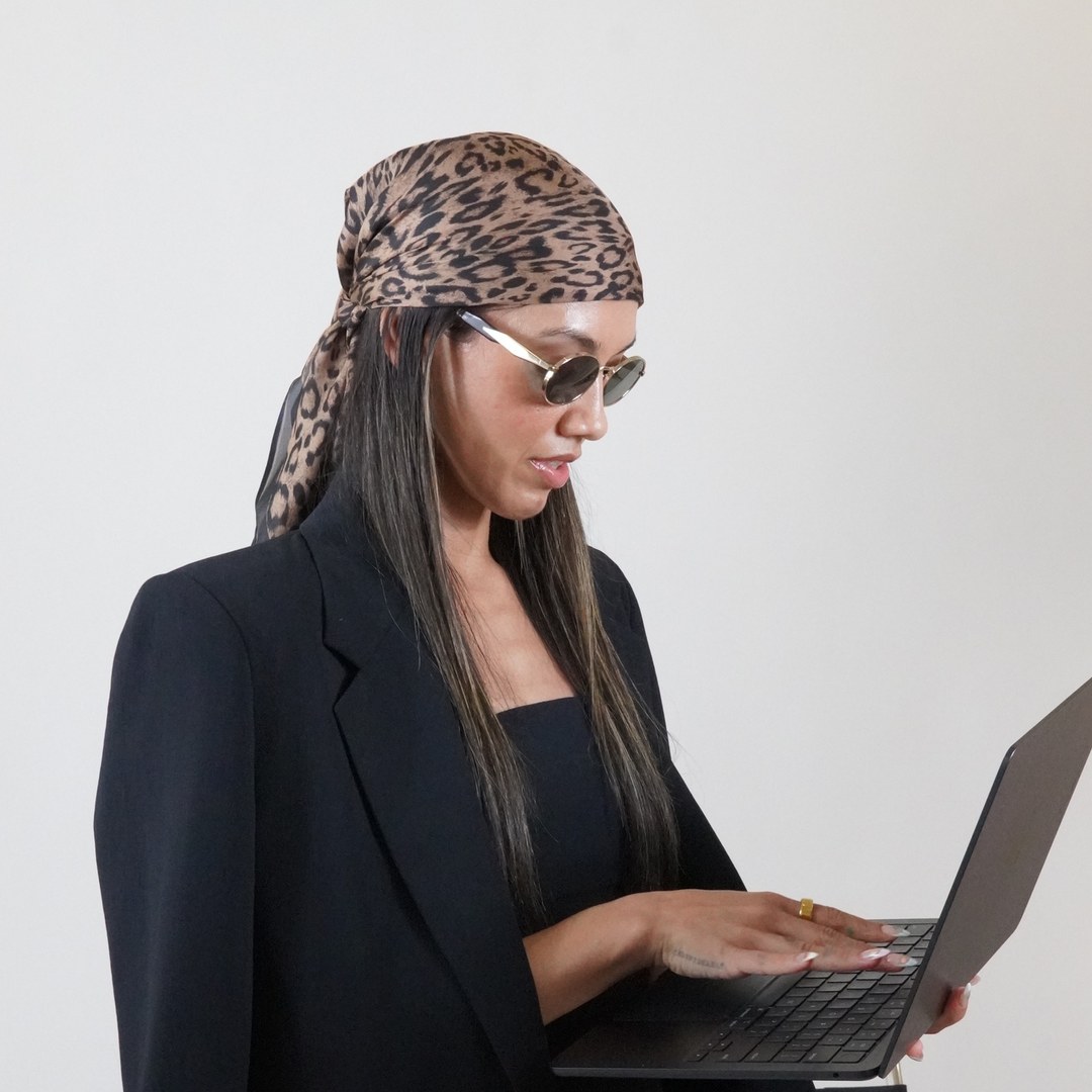 sara typing on a laptop